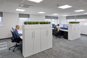 a modern office with plants